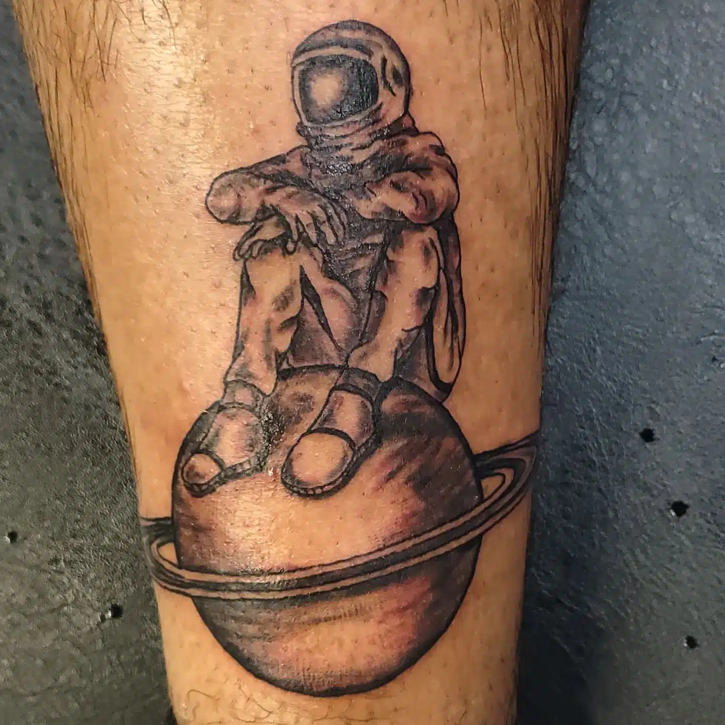 Astronaut Sitting On The Moon Tattoo