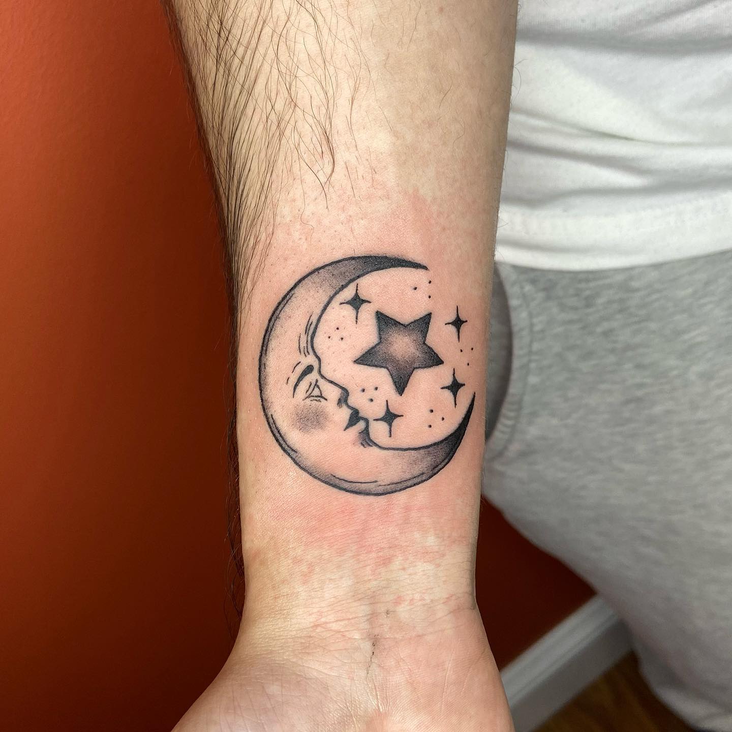 Moon And Stars Tattoo On Forearm