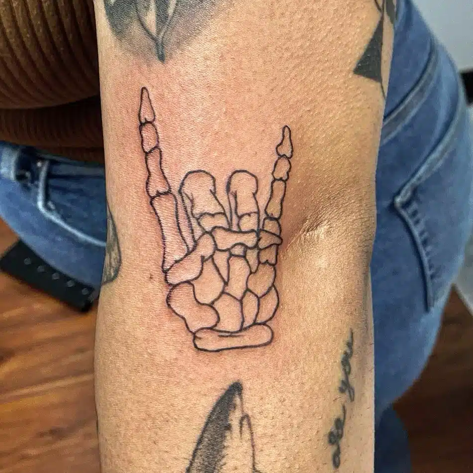 Rock And Roll Skeleton Hand Tattoos