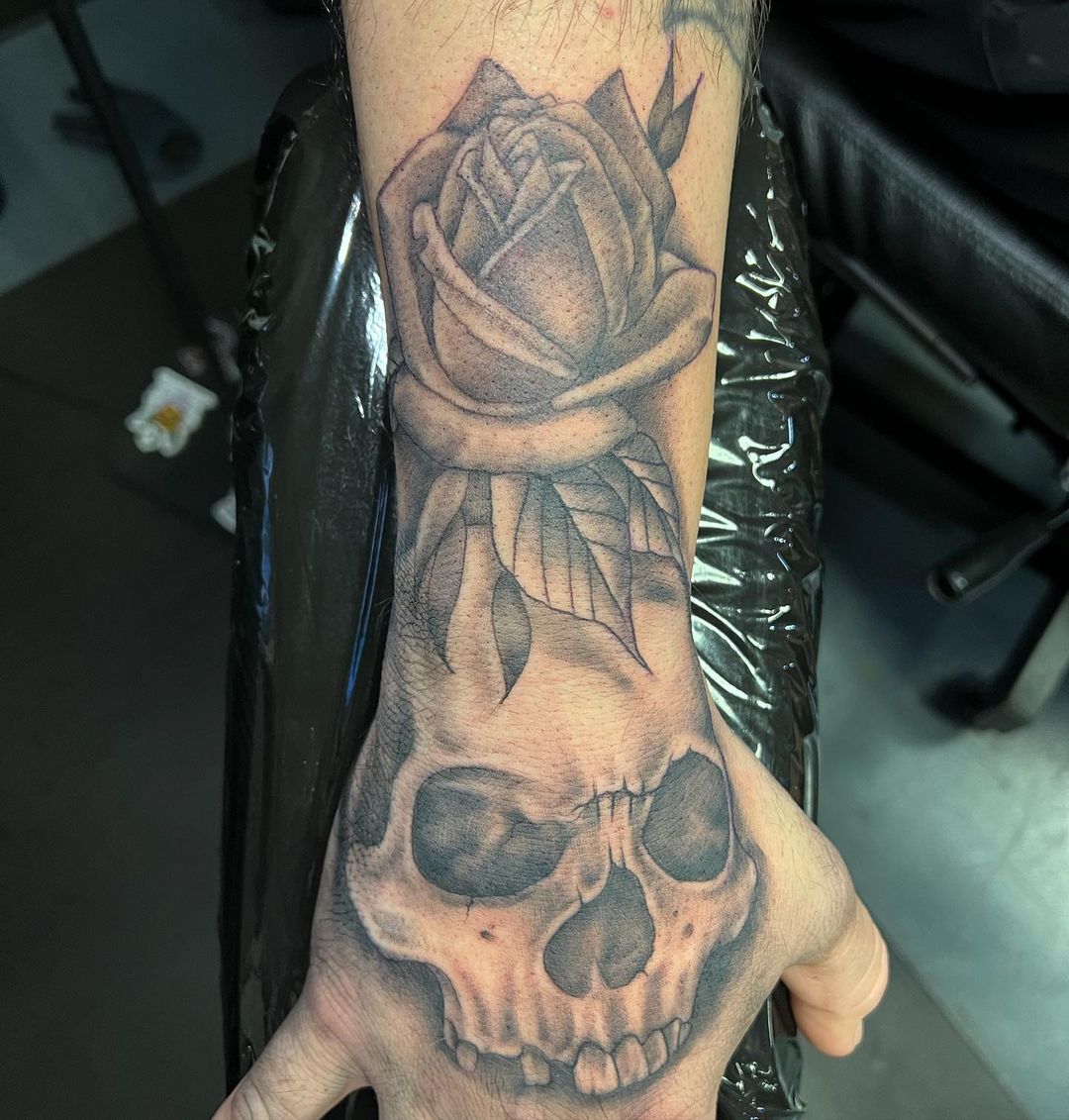 Skeletons And Roses Hand Tattoos