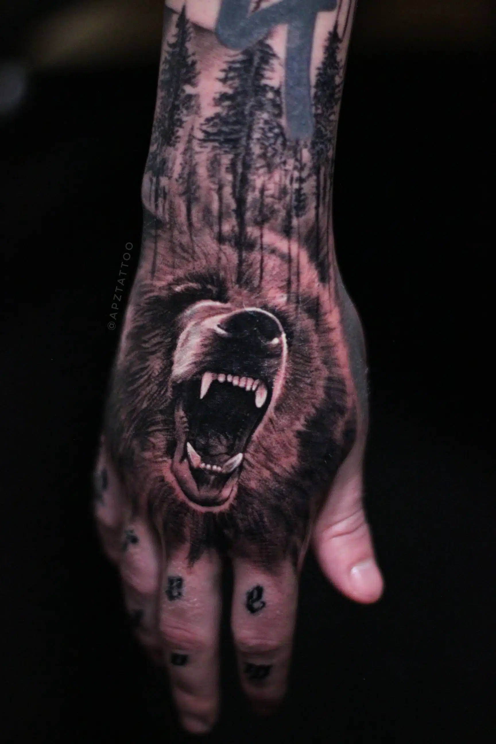 Bear hand tattoo