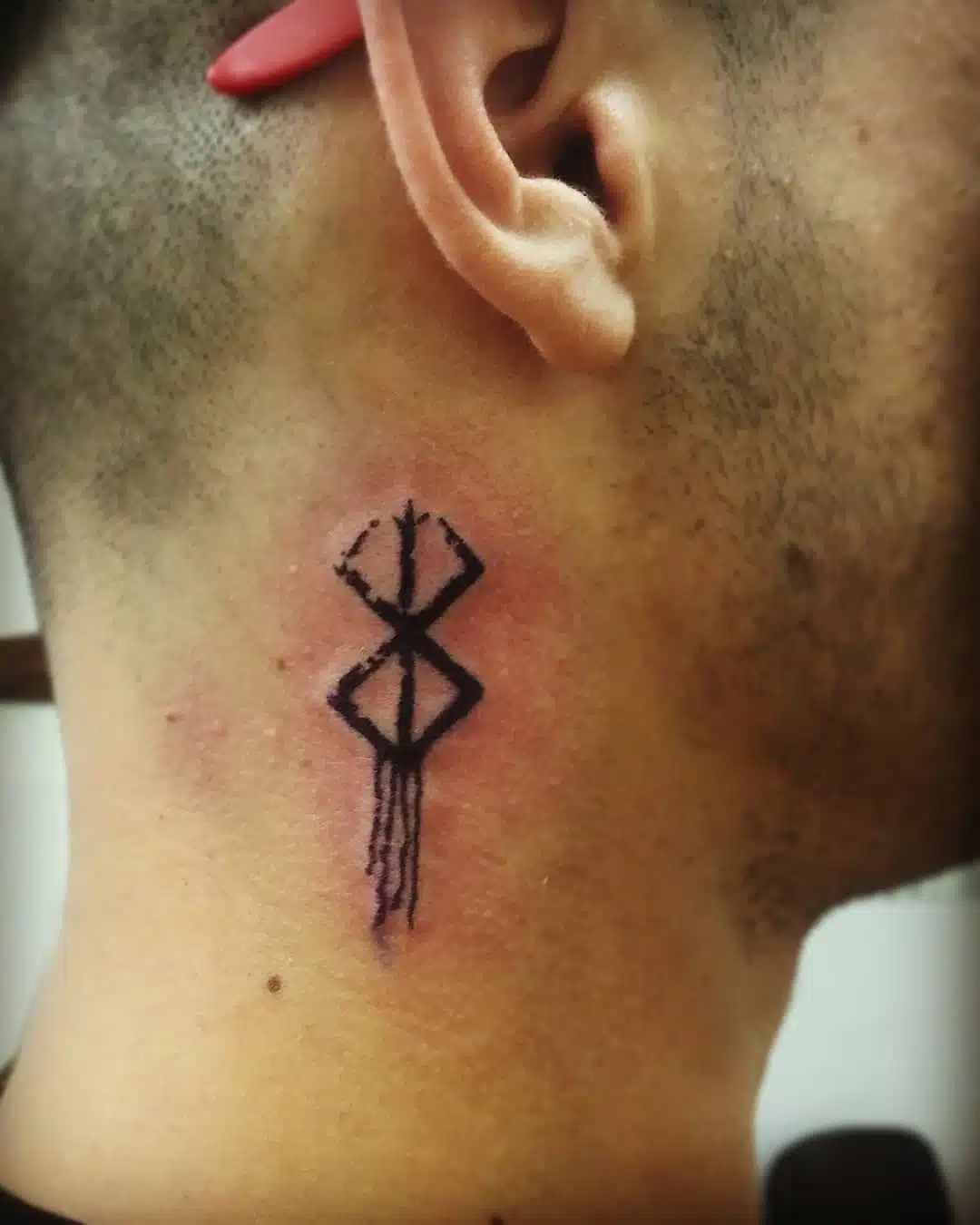 Berserk curse mark tattoo