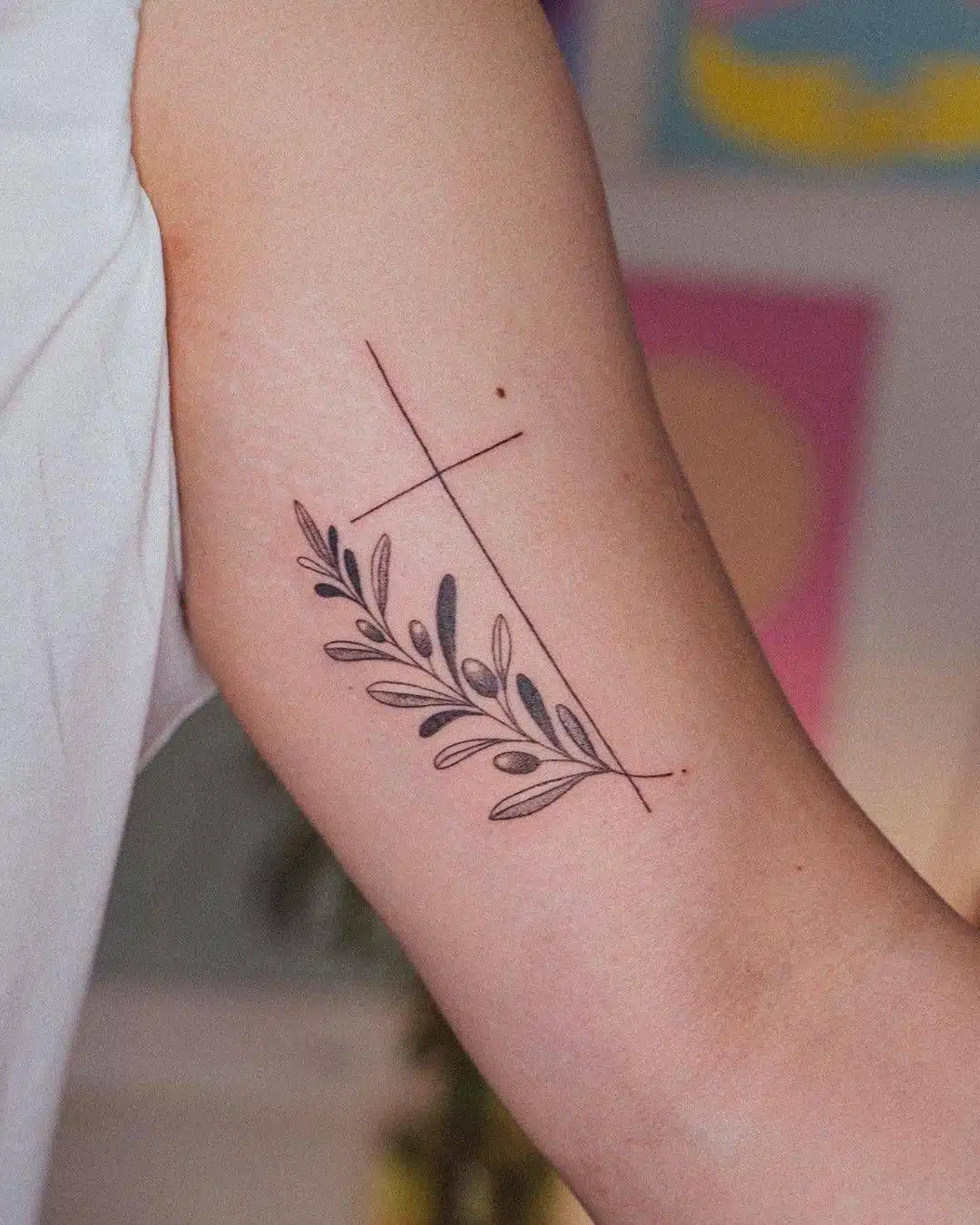 Cross and olive branch tattoo
