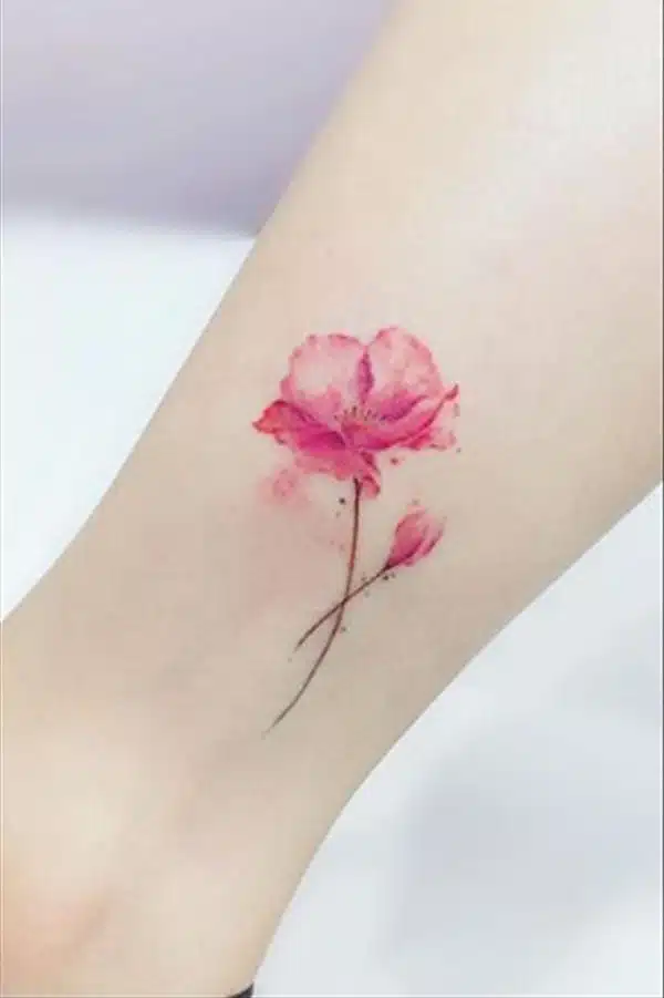 Pink poppy flower tattoo