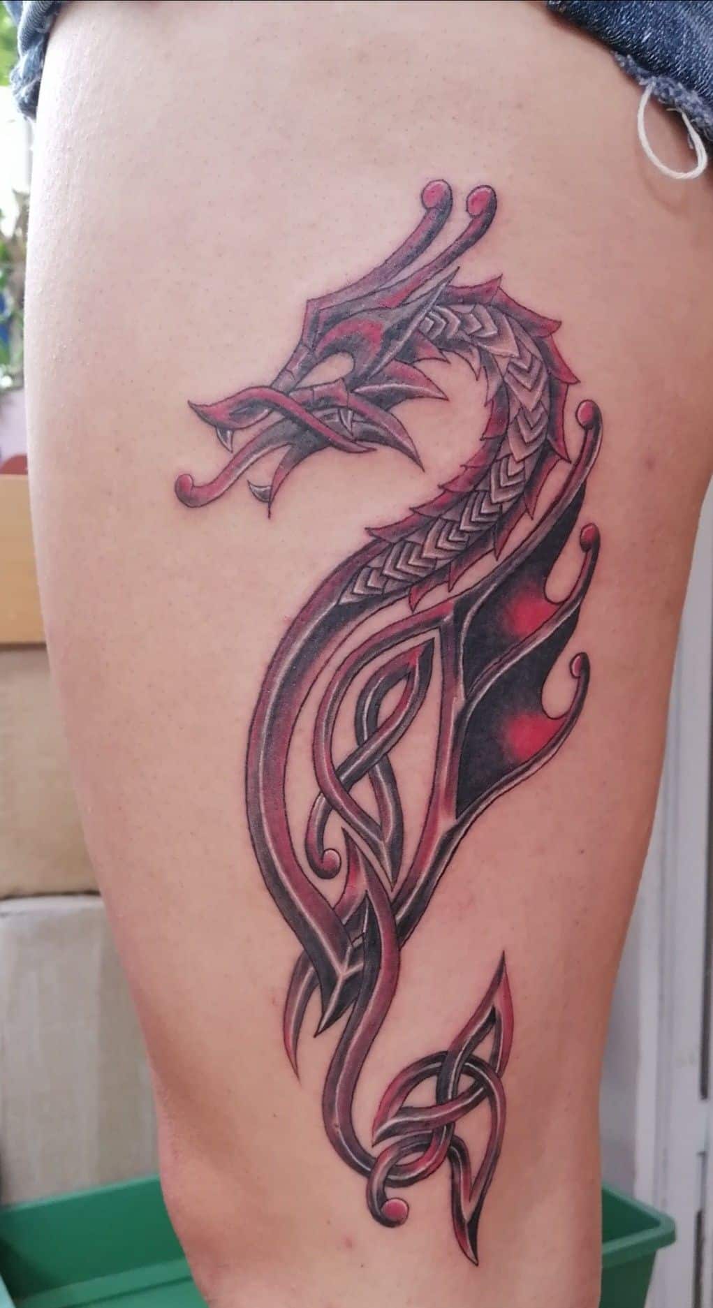 Red celtic dragon tattoo