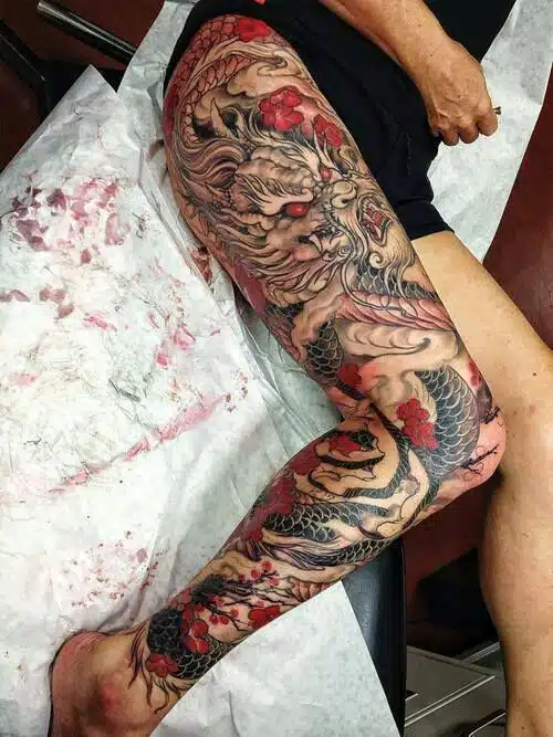Red dragon leg tattoo