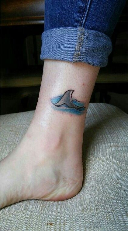 Shark fin tattoo