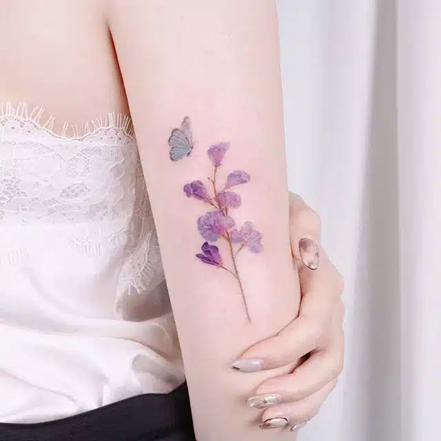 Watercolor sweet pea flower tattoo
