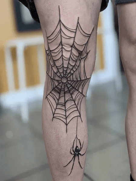 spider web knee tattoo