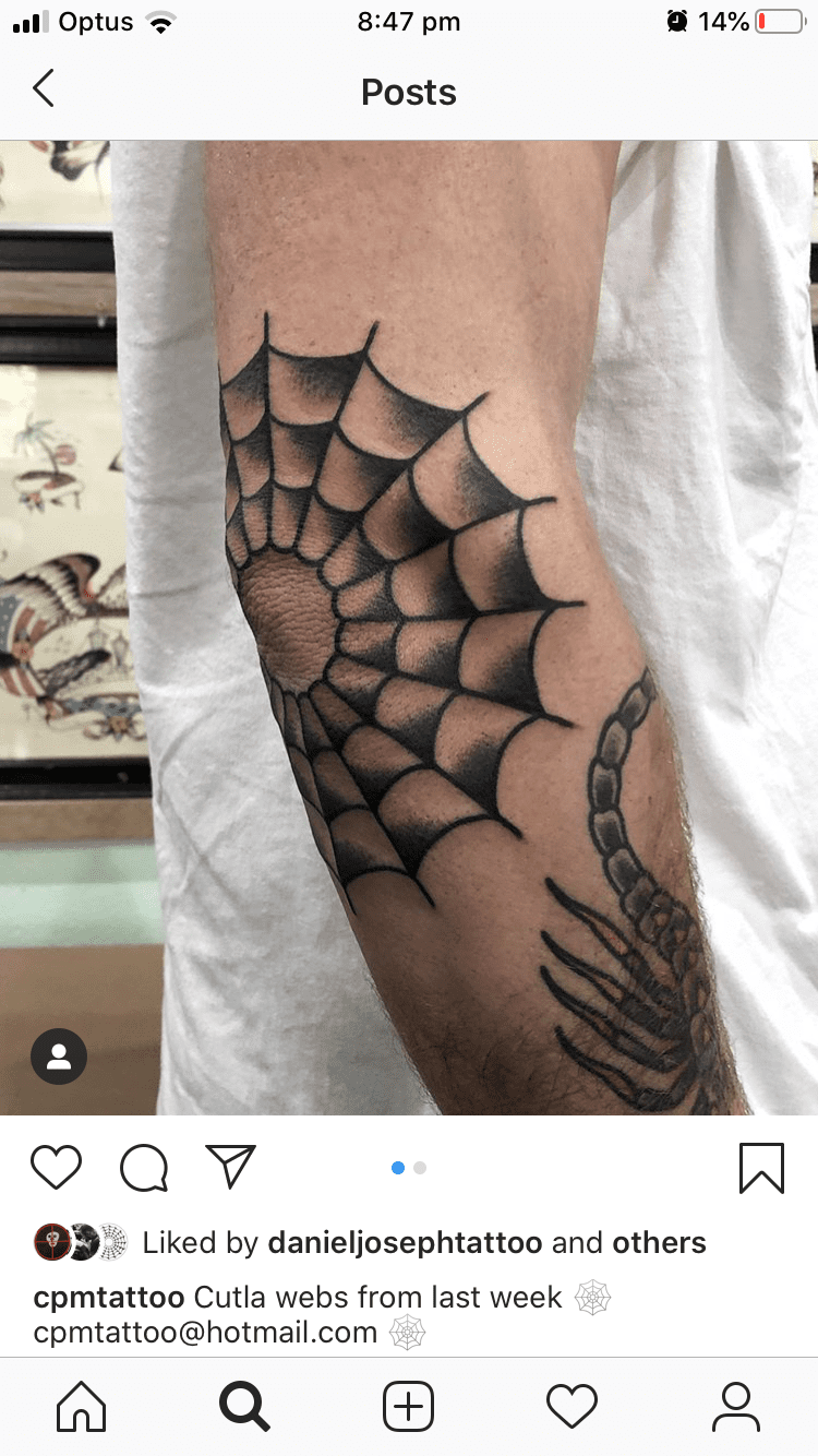 spiderweb elbow tattoo