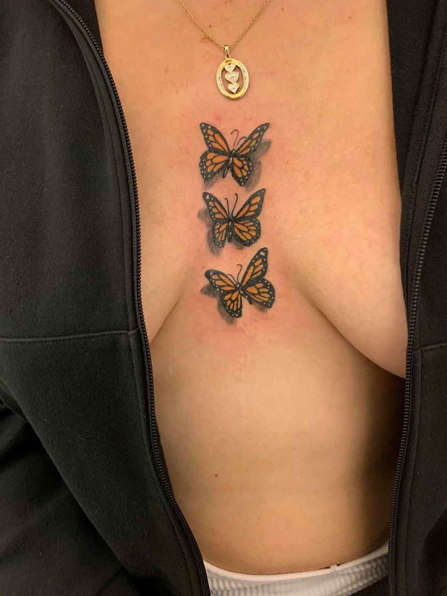 Butterfly chest tattoo for women
