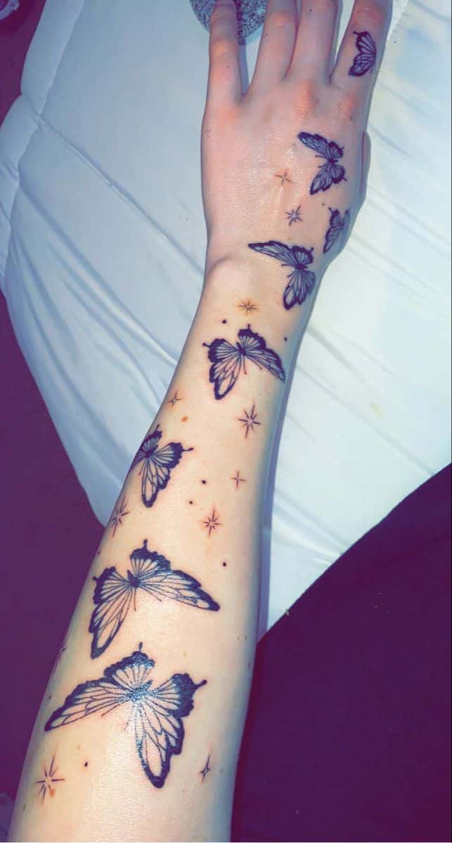 Butterfly hand tattoos for women