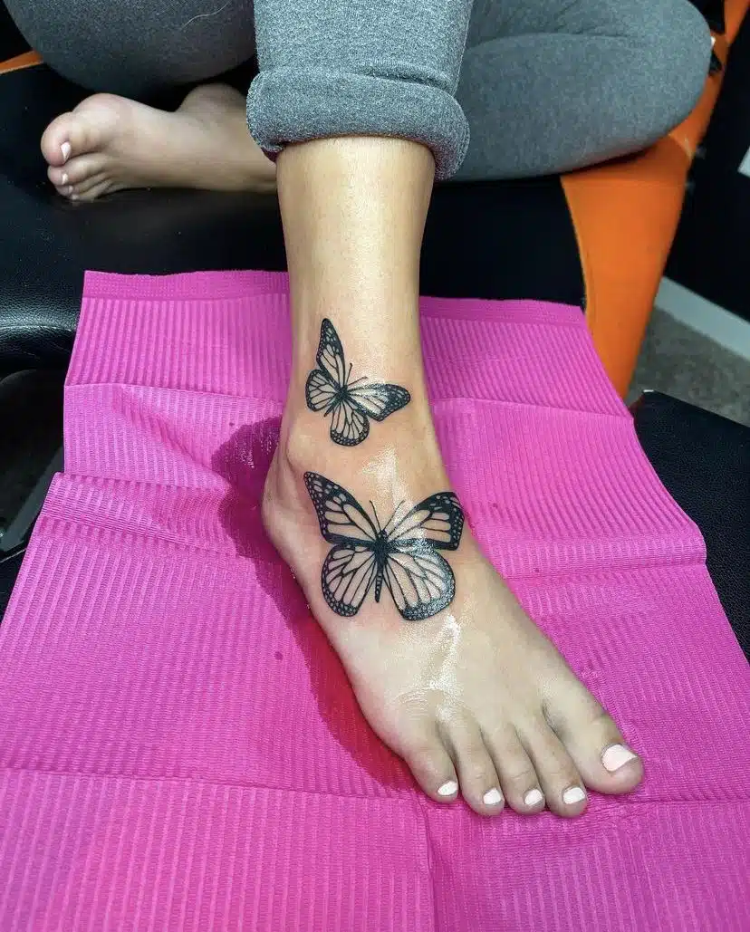 Butterfly leg tattoo for women