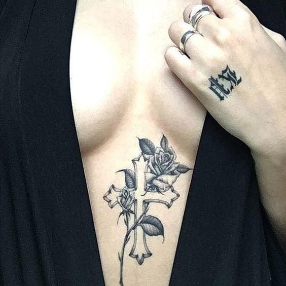 Cross chest tattoos for women