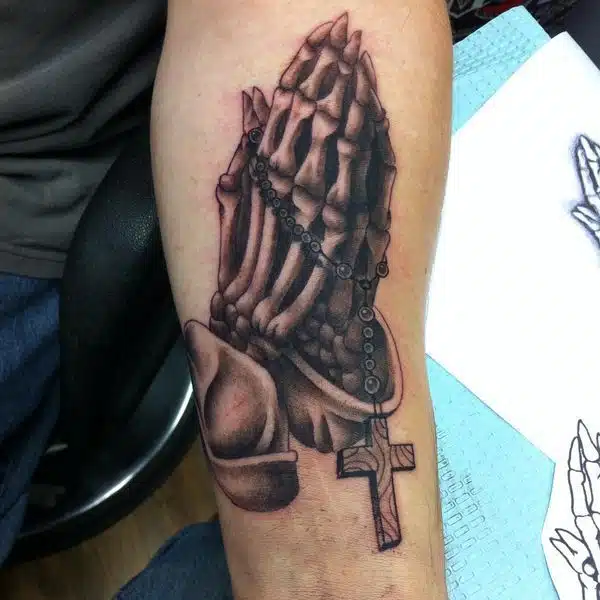 Skeleton praying hands tattoo