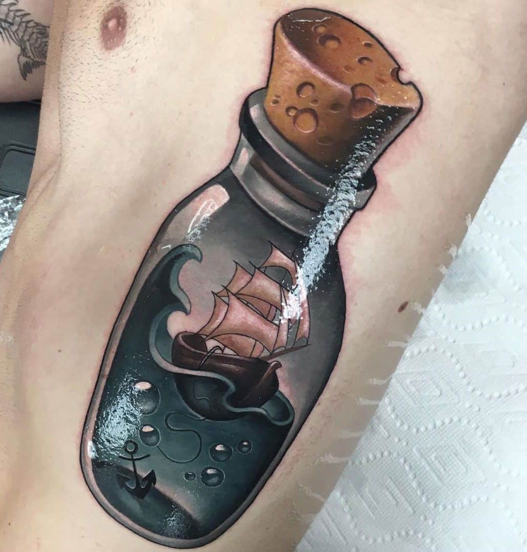 Traditional ship in a bottle tattoo