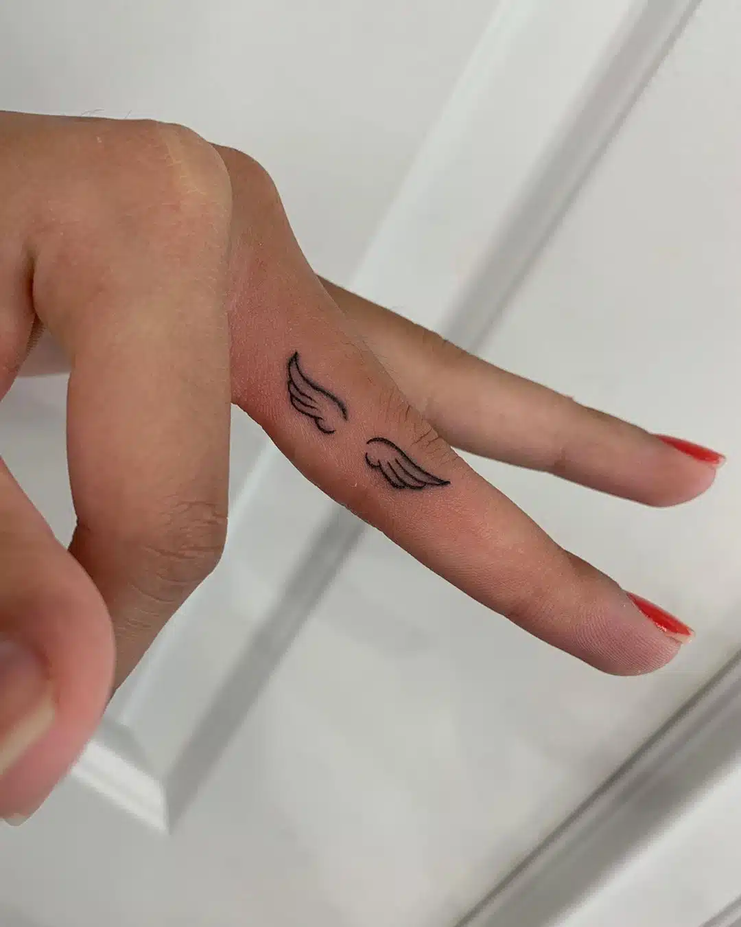 Womens finger tattoos