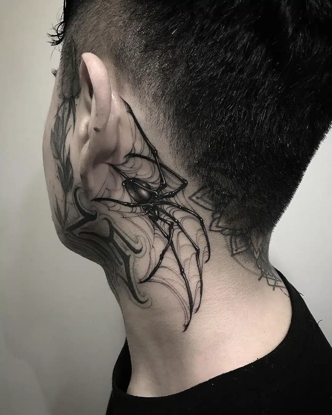 Behind the ear gothic tattoo