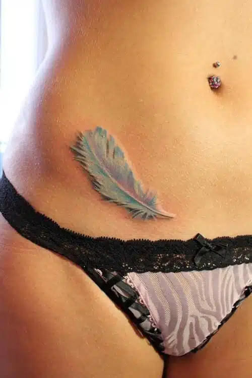 Feather hip tattoos