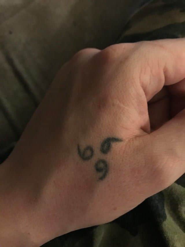 Hand 999 angel number tattoo