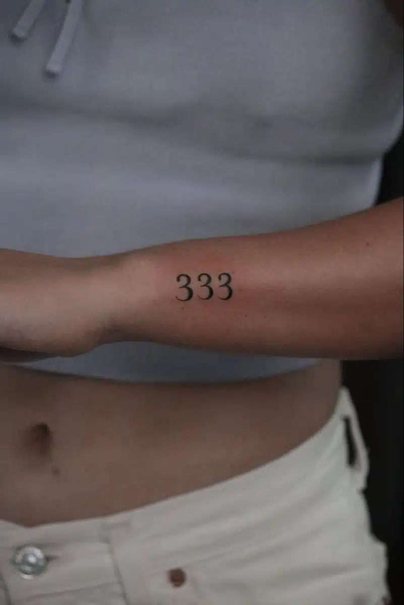 Lower arm 333 angel number tattoo