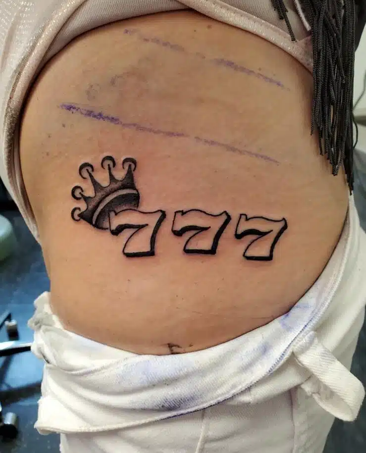 Ribs 777 angel number tattoo