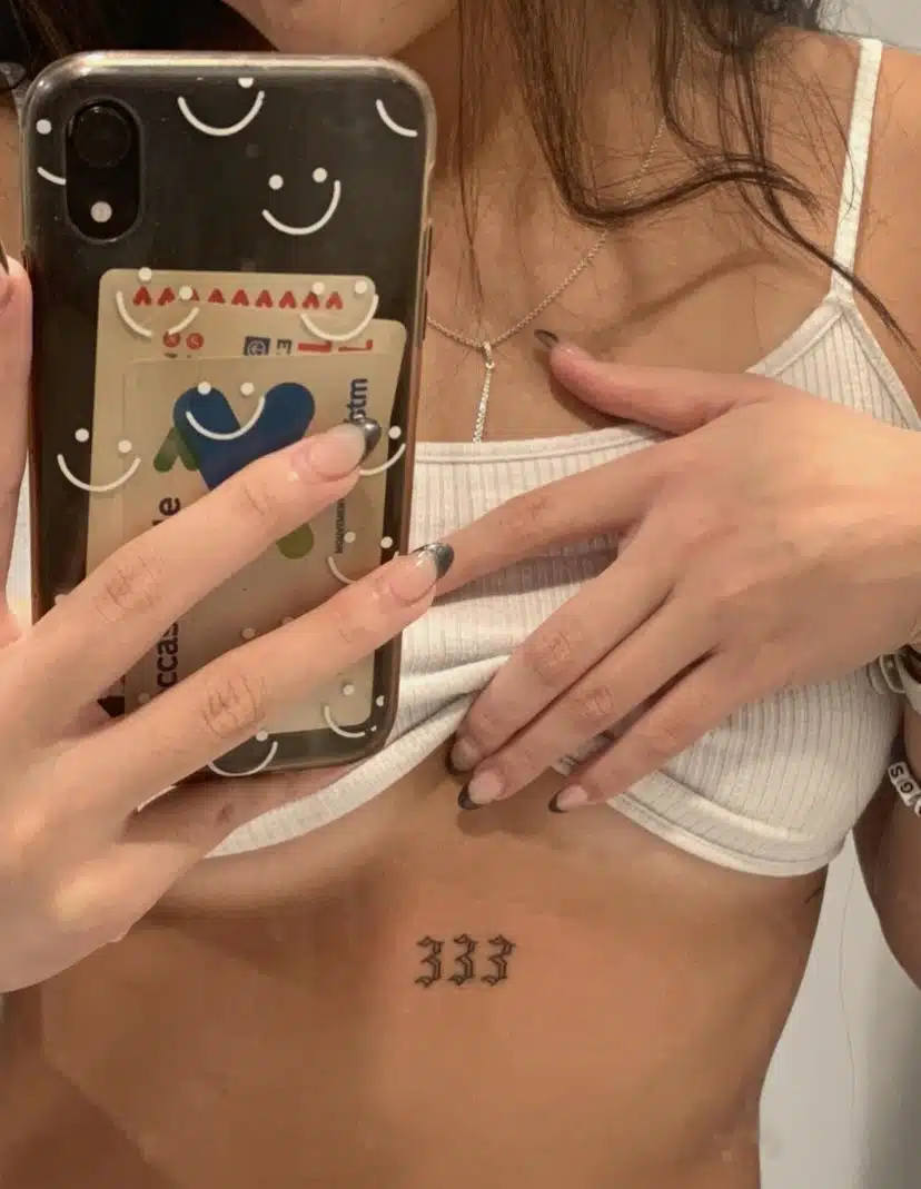 Underboob 333 angel number tattoo