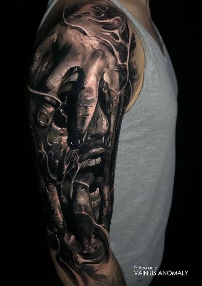 Upper arm gothic tattoo