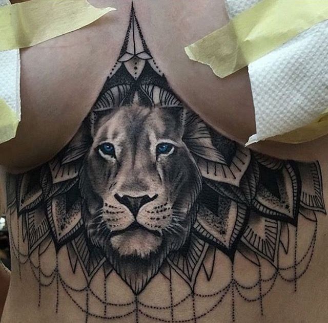 symbolic animal under boob tattoo