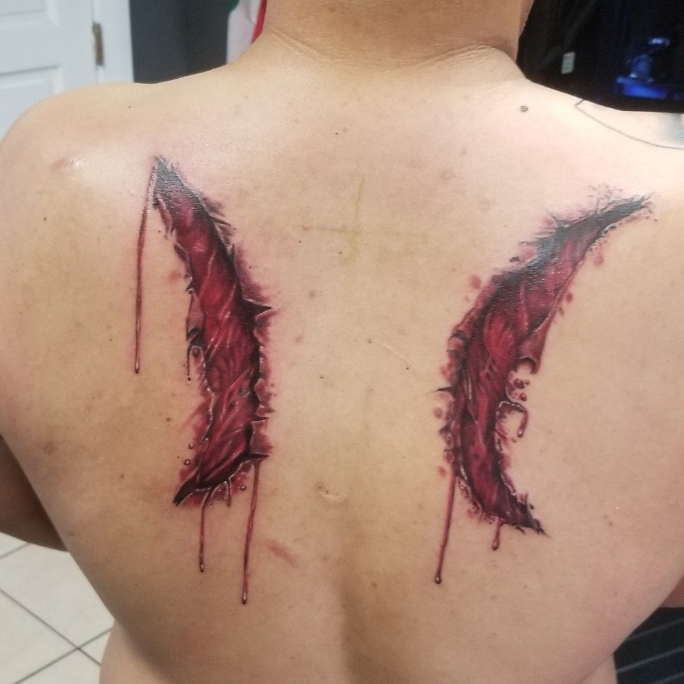 Broken Or Fallen Angel Wings Tattoo